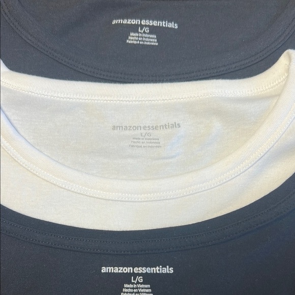 Women large Amazon tops in white and black. One top has a wider neckline. - Picture 11 of 14